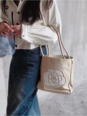 CHANEL Cream Tote with Raised Camellia Appliqué